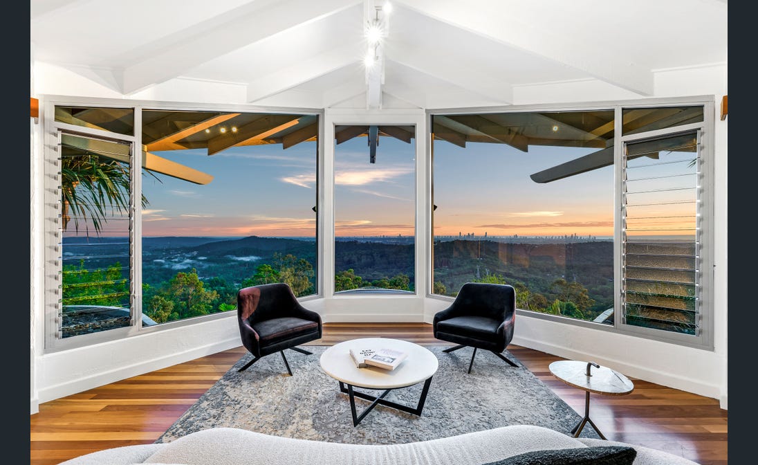Lounge chairs facing the hinterland at sunset